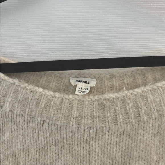 Garage | Off-The-Shoulder Sweater fits XS-M . Made with a soft knit fabrication. - Picture 2 of 5